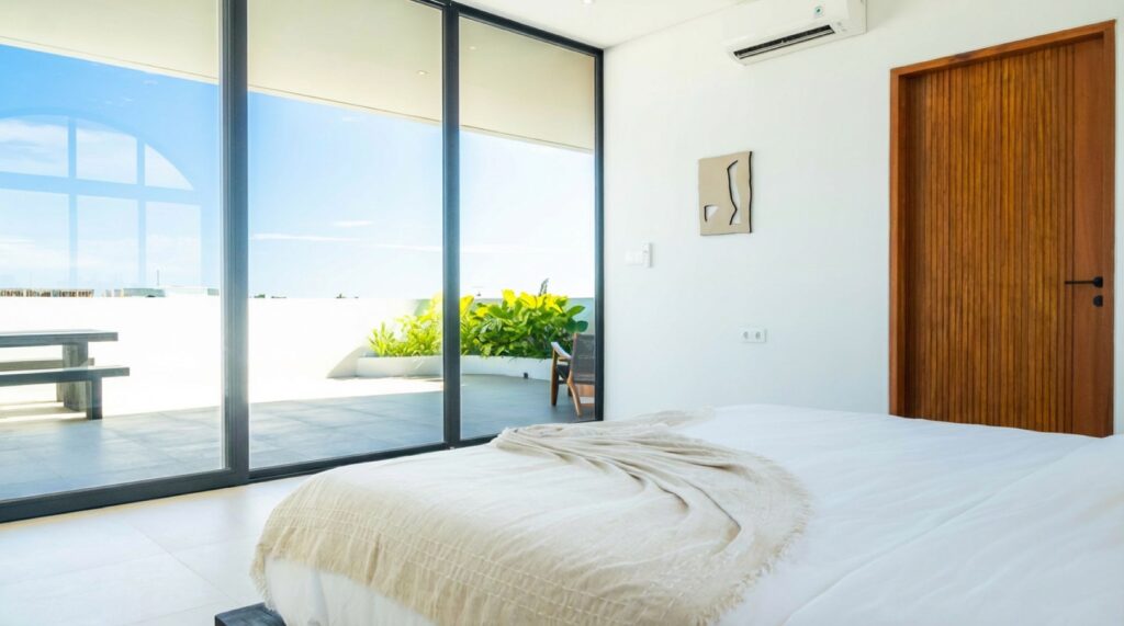 Bedroom with terrace access and feature artwork, Villa Uno