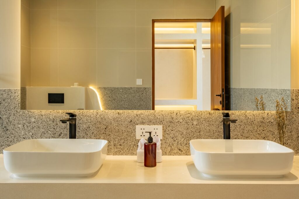 Twin basins and mirror in a Villa Tre bathroom