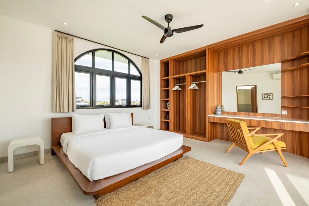 Bedroom with custom built-in wardrobe and desk at Villa Quattro