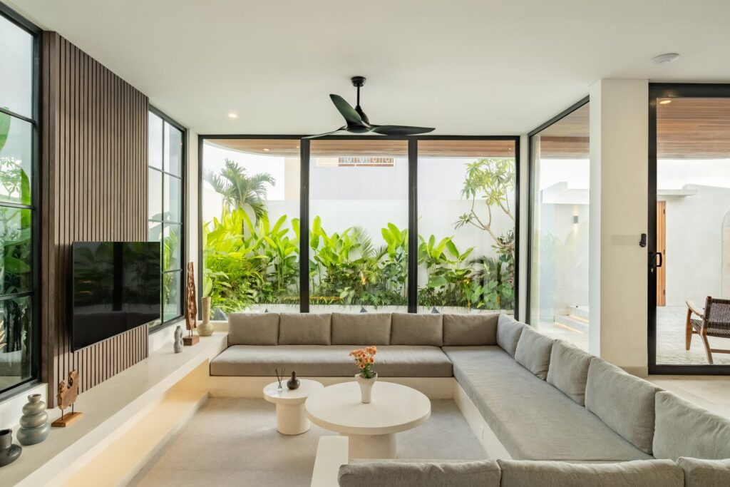 Living room looking out to the tropical garden at Villa Quattro