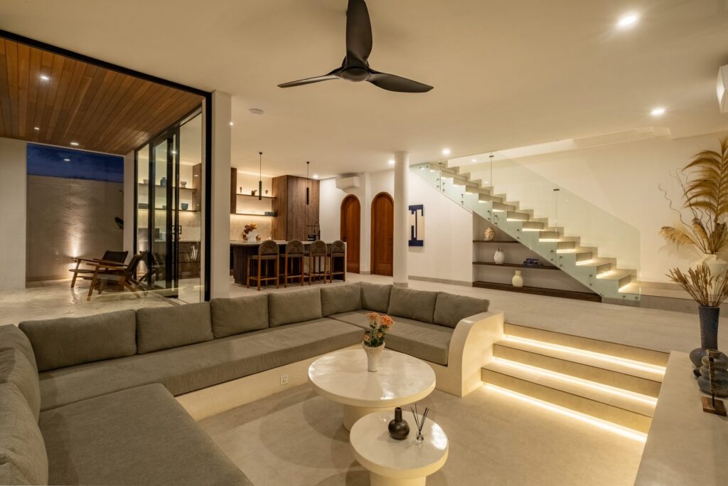 Open plan living and staircase at Villa Quattro in the evening