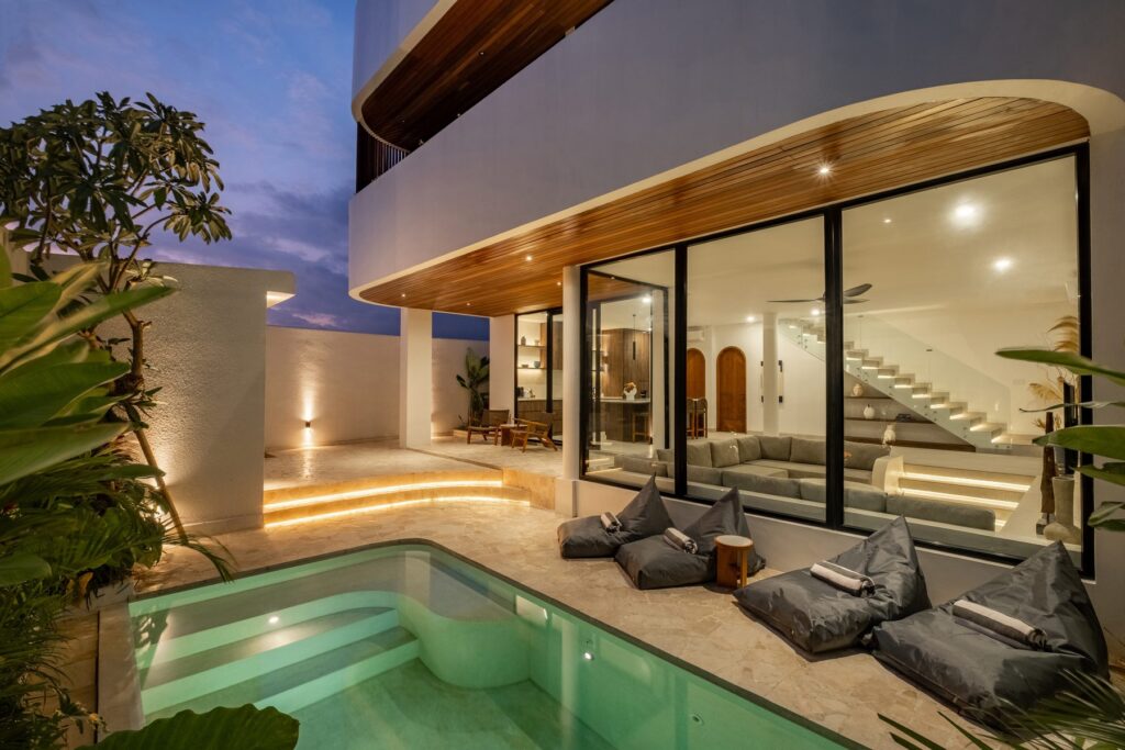 Villa Quattro private pool lit at dusk