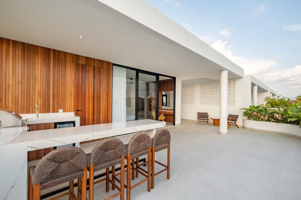 Rooftop wet bar with seating at Villa Quattro
